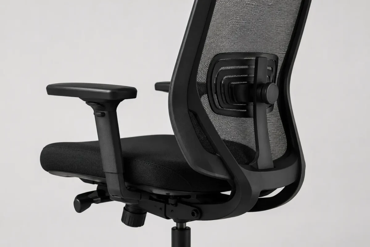close-up of adjustable ergonomic office chair showing lumbar support mechanism and armrests